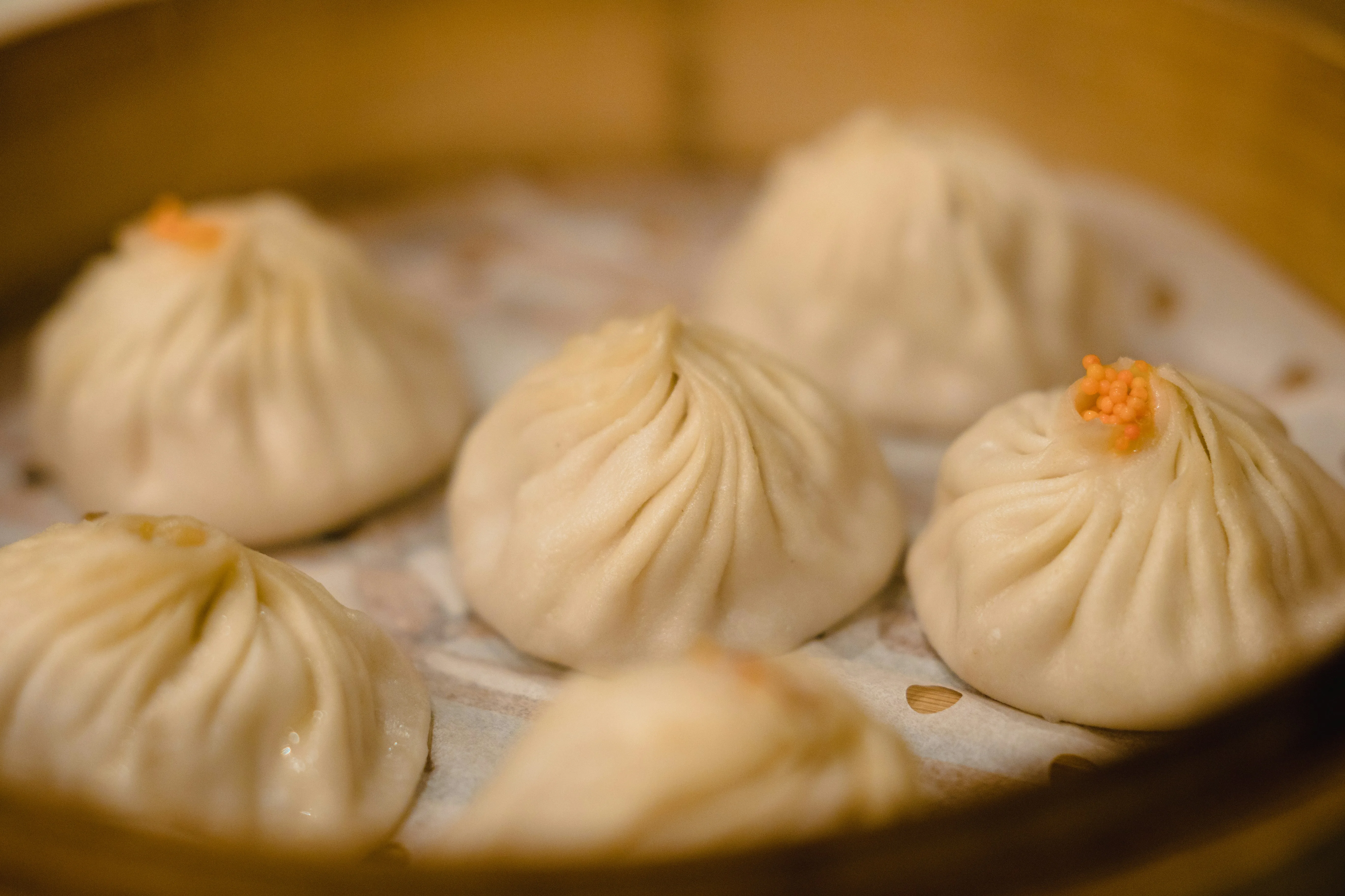 Soup dumplings (xiaolongbao) in a bamboo steamer